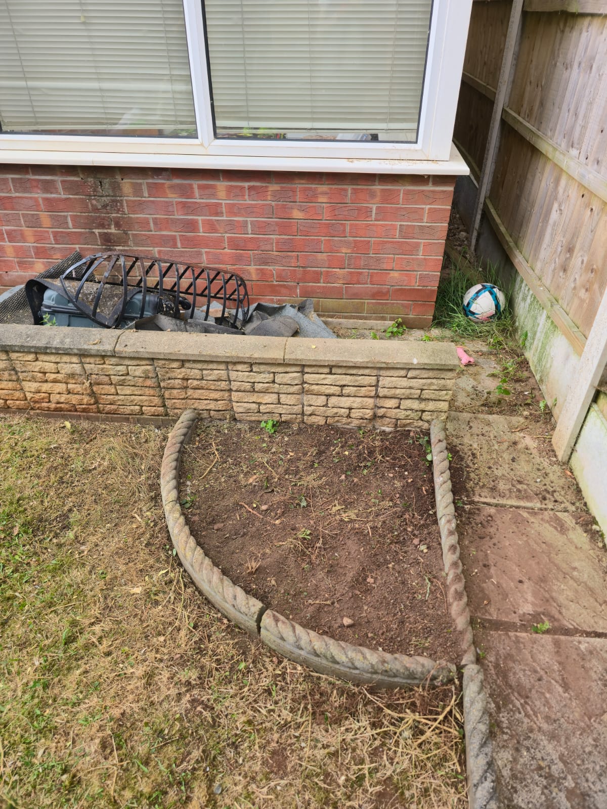 After garden clearance - clean prepared soil ready for new planting